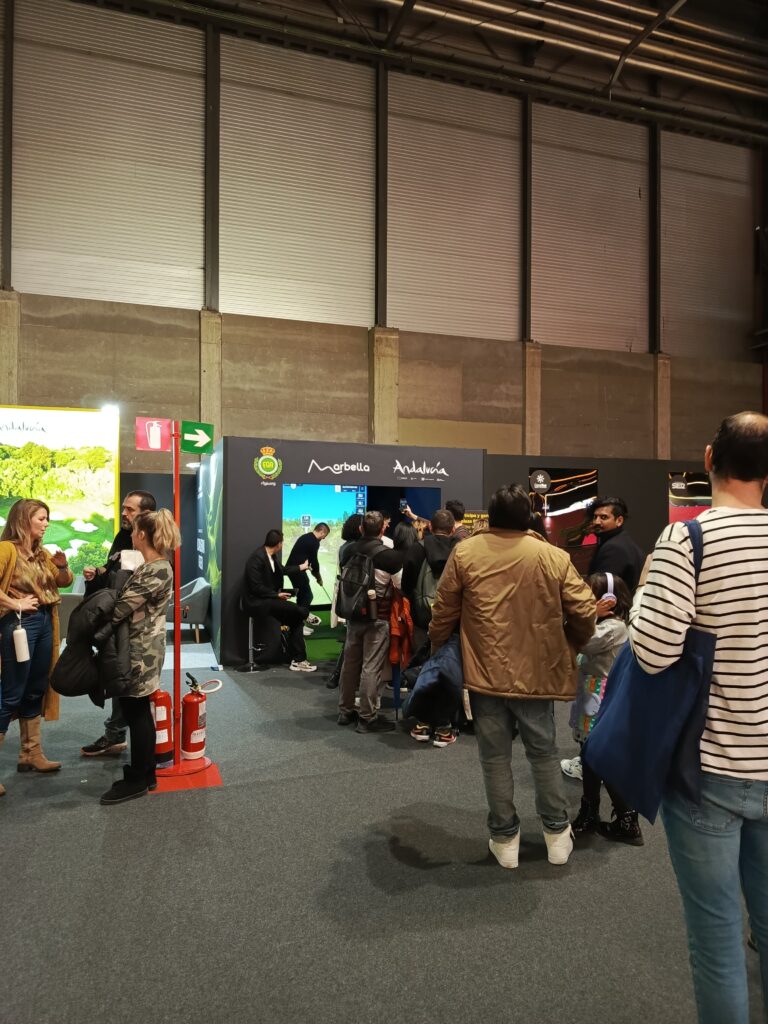 FITUR in Madrid experiencing a mobile golf simulator for the visitors
